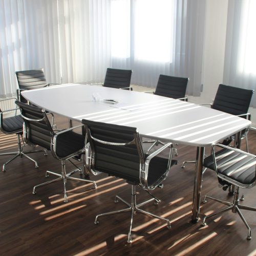Office meeting room with a large table and chairs